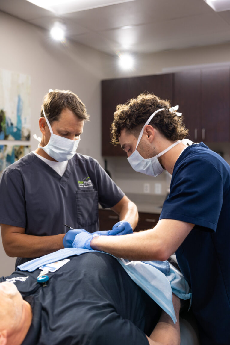 David Myers and Jason Evans performing Mohs surgery for skin cancer.